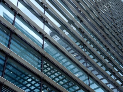 A full frame modern office architecture abstract with geometric shapes and buildings reflected in