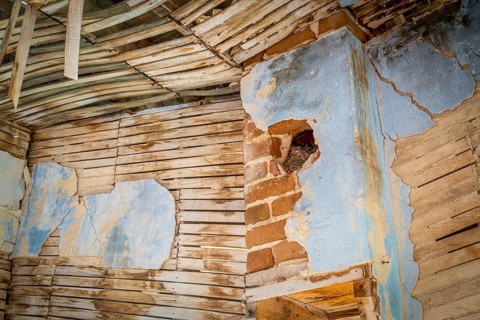Urban decay abstract - damaged interior od an abandoned house at an old gold mine in Colorado