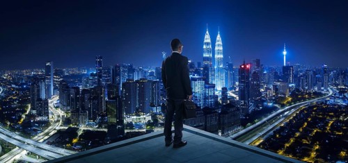 Businessman stand at rooftop looking great cityscape view and thinking business plan of the future