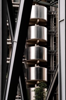 Close-up of an industrial-style building featuring metal structures and vertical elements, London,