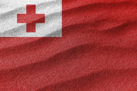 Tonga sand flag, national flag sand background