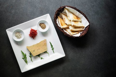 Traditional french foie gras duck pate and toast starter snack platter