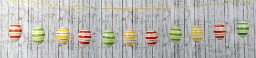 Colourful Easter eggs on a string in a row