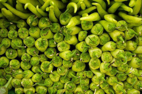 A Lot of green Peppers found as food background