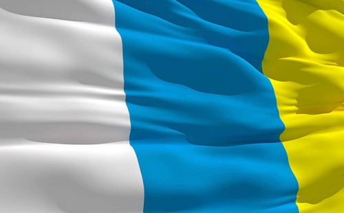 Fluttering flag of Canary Islands on the wind