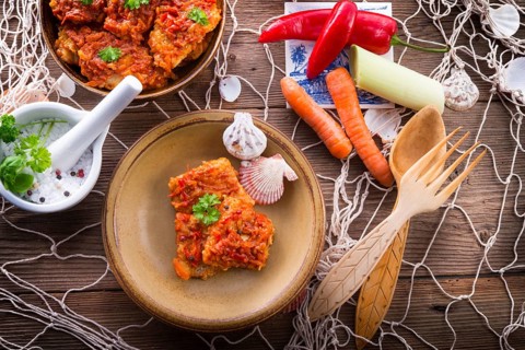Fish in Greek kind with vegetables and tomato sauce