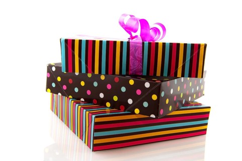 Stacked gifts striped and dotted isolated over white