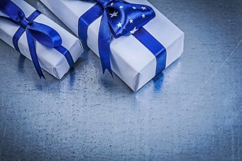 Collection of packed present boxes on metallic background celebrations concept