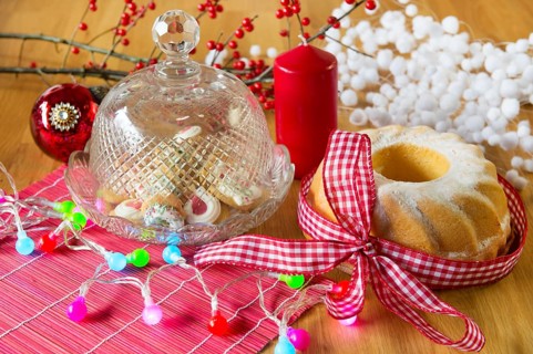 Christmas turban and cupcakes as delicatessen with colorful lights