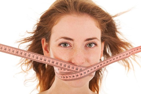 Woman with locked mouth for diet