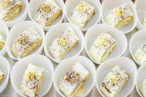 A lot of Swiss rolls on buffet table, catering
