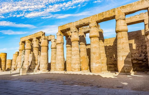 Colonnade in Karnak Temple and blue cloudy sky, Luxor