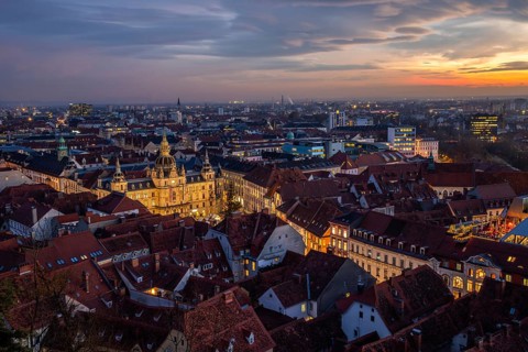 View from the Schlossberg, illuminated town hall, roofs in the old town, blue hour, sunset, Graz,