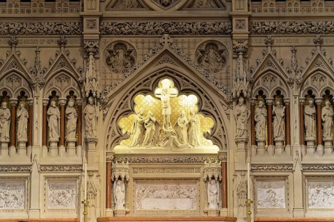 Interior view of the majestic Trinity Church, Detailed reliefs and sculptures on a church wall,