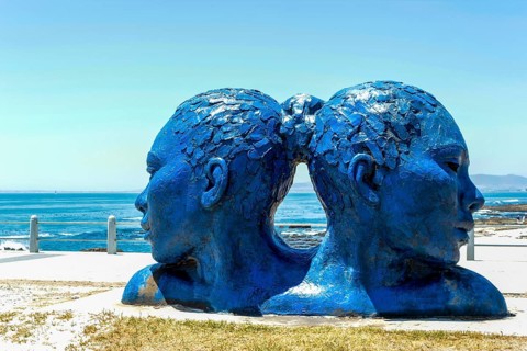 Blue heads statue in Cape Town. Art of south Africa. Sea Point promenade