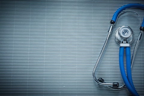 Stethoscope on striped background medicine concept