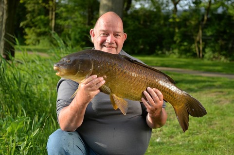 Proud fisherman with self captived carp