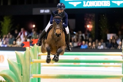 Jessica Burke of Ireland competes in the equestrian Audi Grand Prix at Jumping International