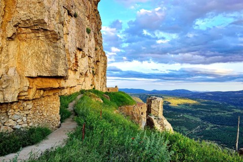 Landscape at sunset with large overhanging rocks and mountain views. Ares in Spain