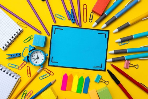 Banner Concept Back To School Alarm Clock Color Chalk Pencil Apple Notebook Stationery on Green