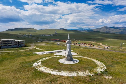 Statue of mongolian Mother and huge equestrian statue of Genghis Khan in the steppe, Mongolia,
