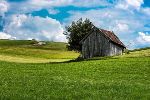 Scenic view over the German countryside around the village Kappel with two old wooden sheds over