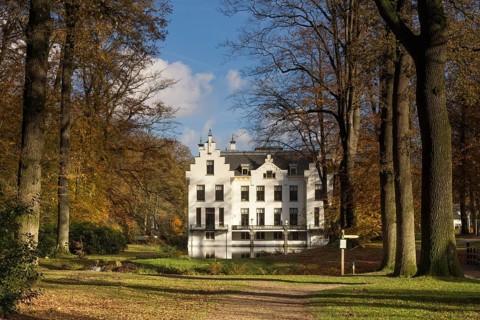 Castle Staverden near Ermelo in the Dutch region Veluwe seen from the surrounding autumn mooded