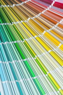 Colour pantone palette fan on wooden board top view