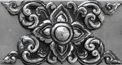 Simple ornament, minted in silver