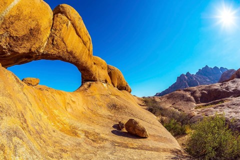 Picturesque stone arches are painted by iron oxides in red-orange color. Nature reserve Spitzkoppe