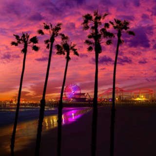 Santa Monica California sunset on Pier Ferrys wheel and reflection on beach wet sand