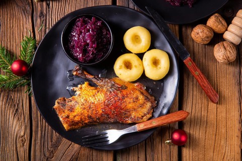 Roast goose with baked apples, red cabbage and dumplings