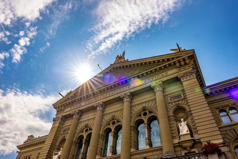 Beautiful Bundeshaus Parliament Building or Federal Palace in a Sunny Day with Sunbeam and Lens