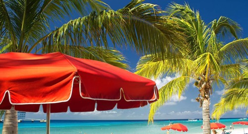 Red Beach Umbrellas and turquoise Waters of Caribbean, Grand Turk