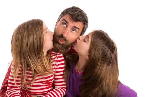 Happy family beard father and two kid daughters blue eyes on white background