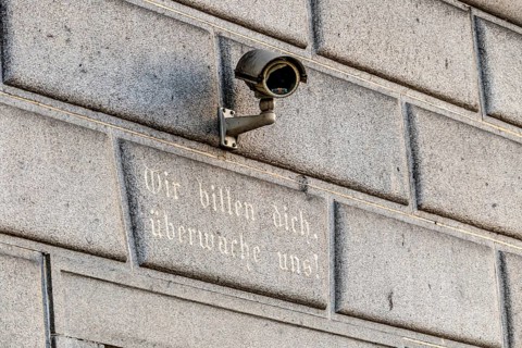 Surveillance camera on a building, symbol for surveillance, internal security, control, data