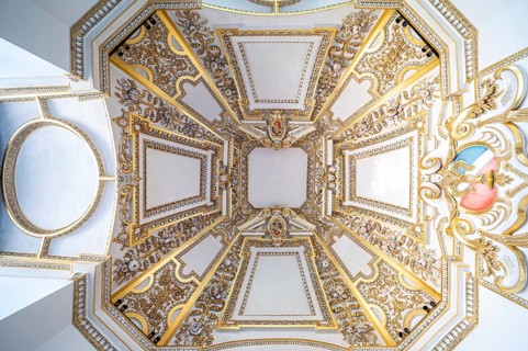 Krakow, Poland, March 23, 2024, Decorated white ceiling with gold plated ornaments, Europe