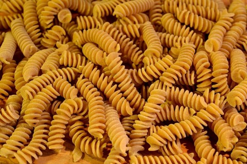 A close up of some raw fusilli