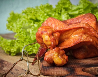Smoked delicious chicken wings on the hardboard