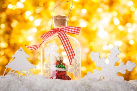 Christmas decor on the snow with gold bokeh background