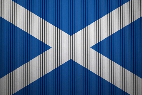 Scotland Flag painted on the cracked grunge concrete wall