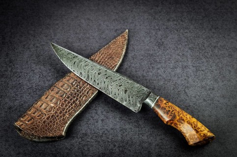 Beautiful luxurious utility knife in Texas Wind damask pattern with noble wood handle on dark