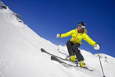 Skier in action, blonde woman, 25, 30, years, downhill skiing, Austria, Europe