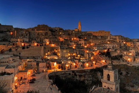 Matera, Italy, 26 November, 2023: view of the old town of Matera after sunset with the lights