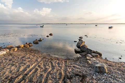 Natural boat ramp on a beach at the Baltic sea in peaceful morning light