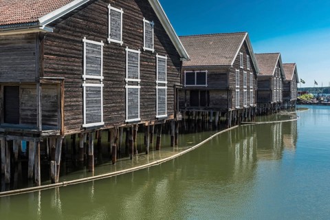 Hudiksvall, Halsingland, Gavleborg County -Sweden, 08 01 2019 Reflecting fishing warehouses in the