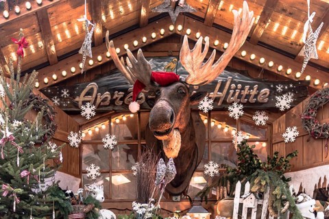Christmas market hut with elk and Christmas decorations