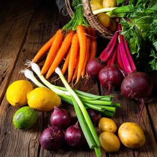 Basket with various vegetables: beetroot and carrots