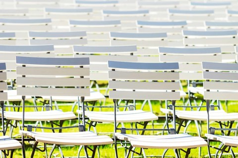 White chair rows in a spa park in black and white medium light