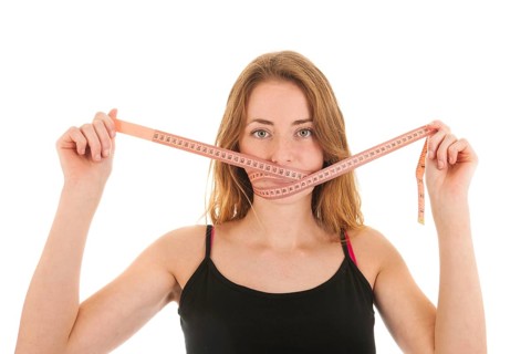 Woman with locked mouth for diet
